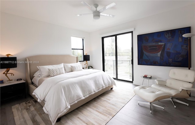 bedroom featuring access to outside, wood-type flooring, and ceiling fan