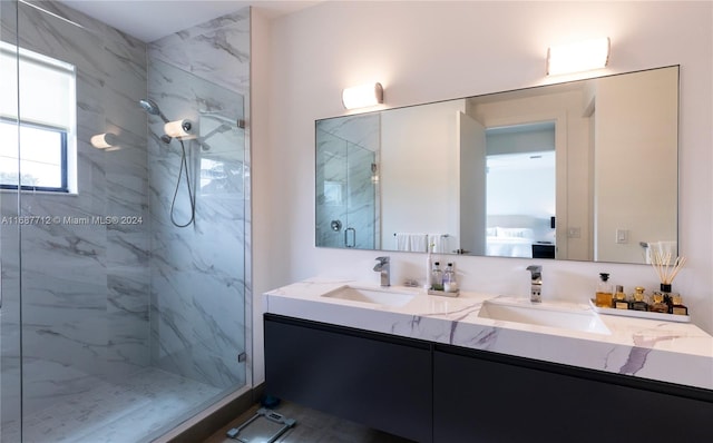 bathroom featuring vanity and tiled shower