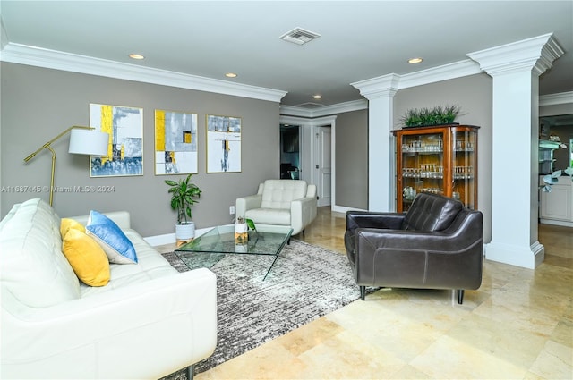 living room featuring ornamental molding and decorative columns