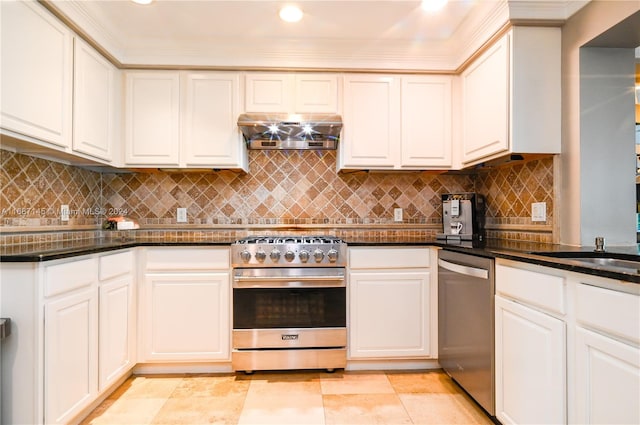 kitchen featuring extractor fan, appliances with stainless steel finishes, and tasteful backsplash