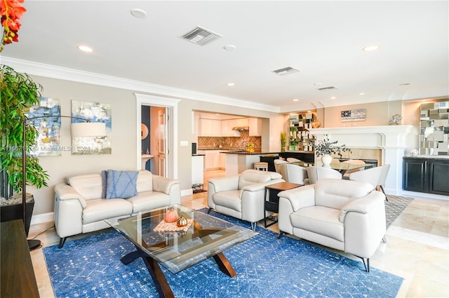 living room featuring crown molding