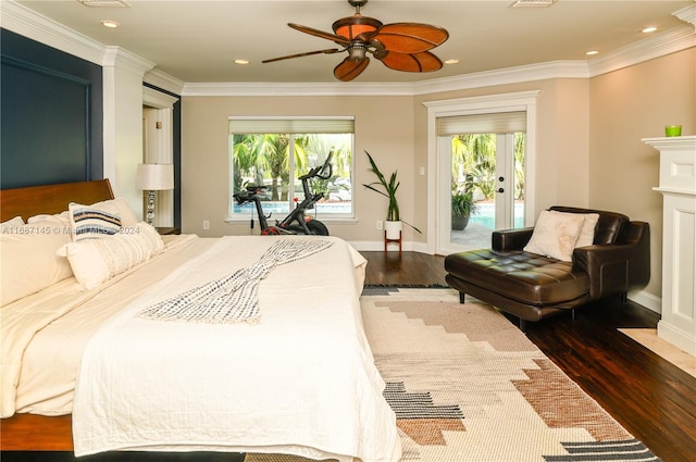 bedroom featuring access to exterior, multiple windows, dark hardwood / wood-style floors, and ceiling fan