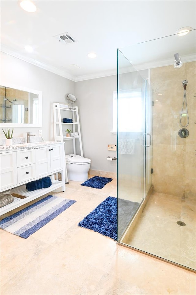 bathroom featuring ornamental molding, an enclosed shower, vanity, and toilet