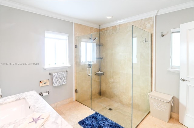 bathroom featuring ornamental molding, tile patterned flooring, walk in shower, and vanity