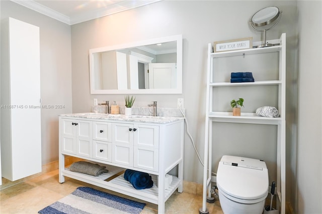 bathroom with toilet, vanity, tile patterned floors, and crown molding