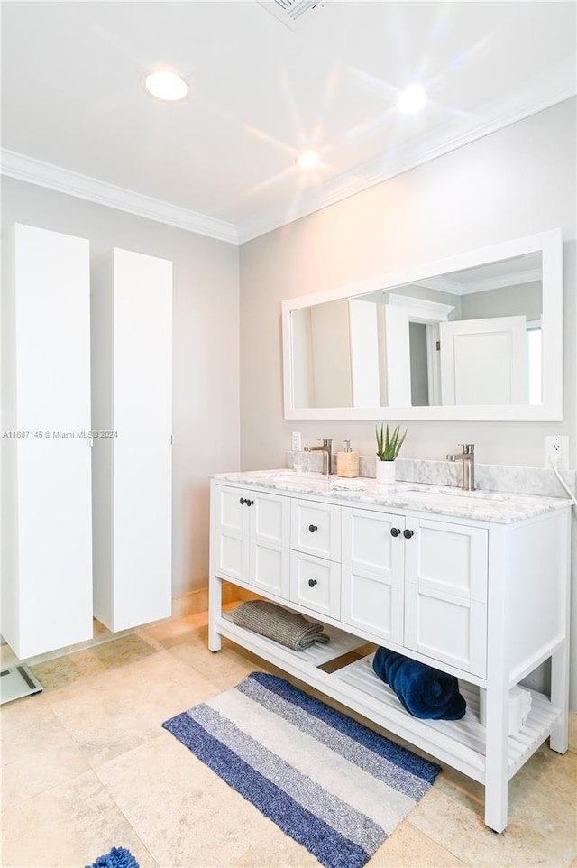 bathroom with vanity and ornamental molding