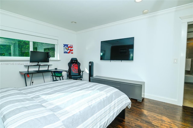 bedroom with dark hardwood / wood-style flooring and ornamental molding