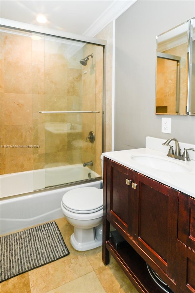 full bathroom with tile patterned floors, enclosed tub / shower combo, crown molding, vanity, and toilet