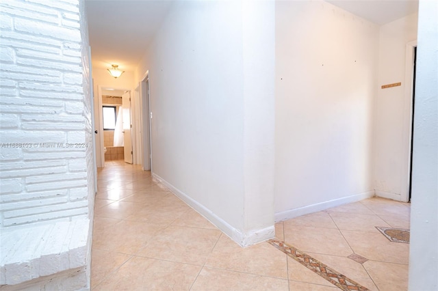 corridor with light tile patterned floors