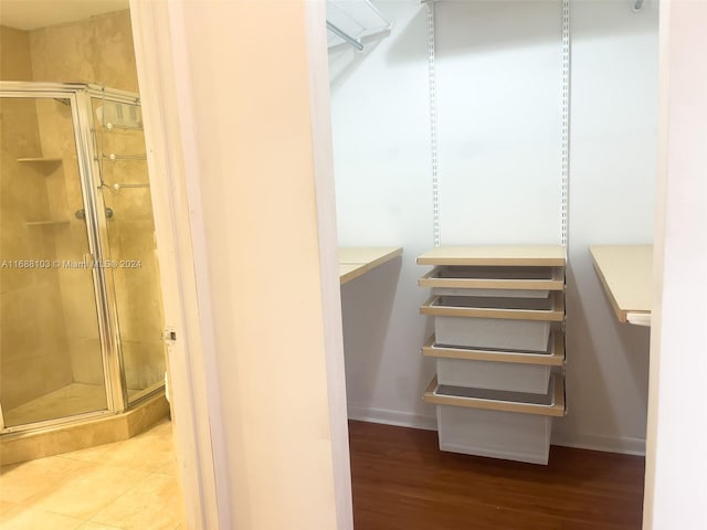 spacious closet featuring hardwood / wood-style flooring