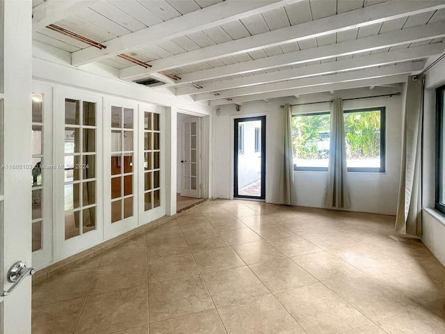 unfurnished sunroom with beam ceiling and wood ceiling