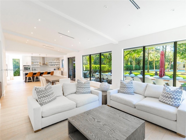 living room with light wood-type flooring and vaulted ceiling with beams