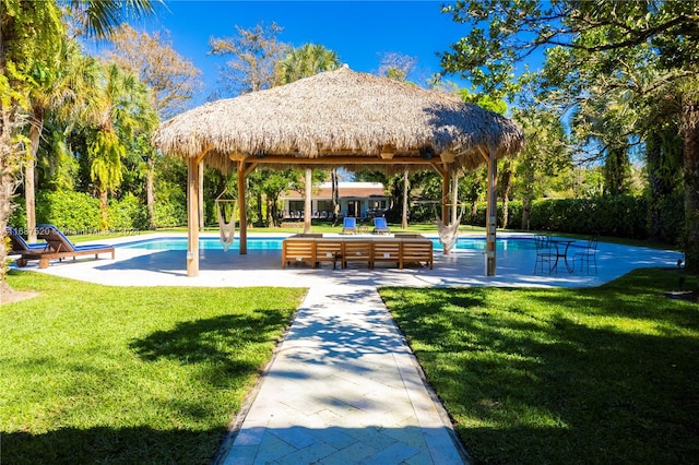 view of swimming pool featuring a patio area, a yard, and a gazebo