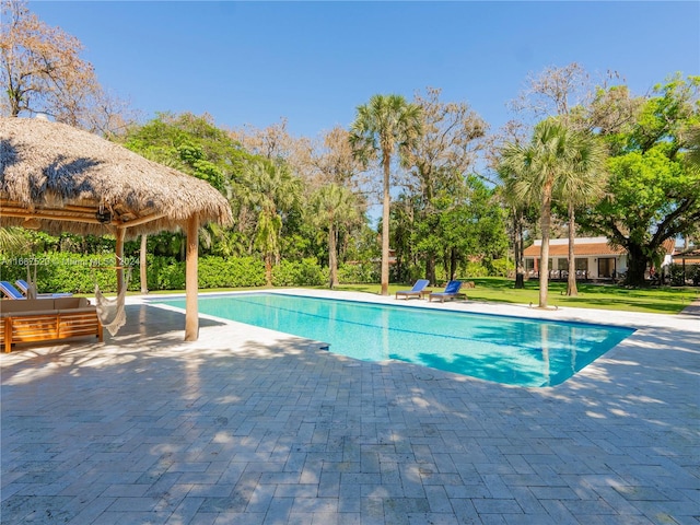 view of swimming pool featuring a patio area and a gazebo