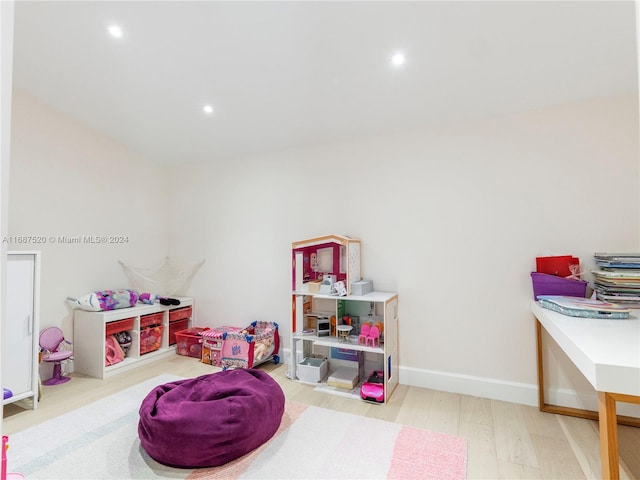 game room with hardwood / wood-style floors