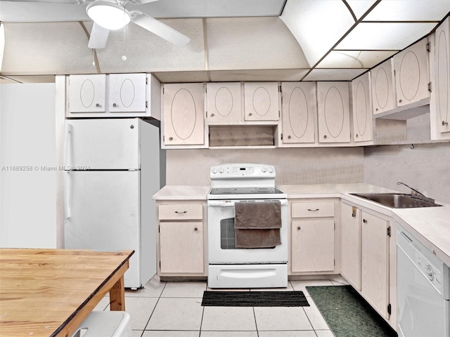 kitchen featuring white appliances, ceiling fan, sink, and light tile patterned flooring