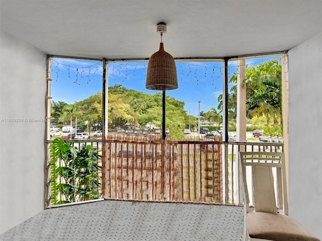 unfurnished sunroom featuring a healthy amount of sunlight