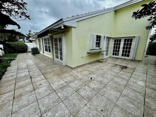 view of patio / terrace featuring central AC unit and french doors