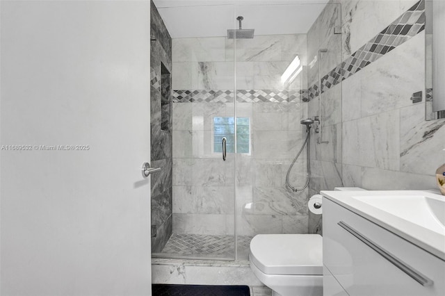 bathroom featuring tile walls, an enclosed shower, toilet, and vanity