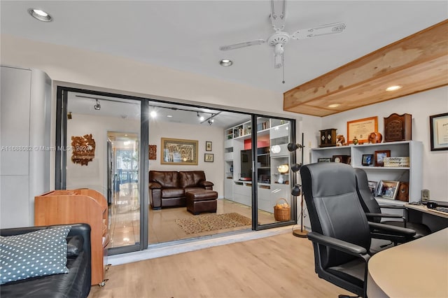 office featuring light hardwood / wood-style floors and ceiling fan