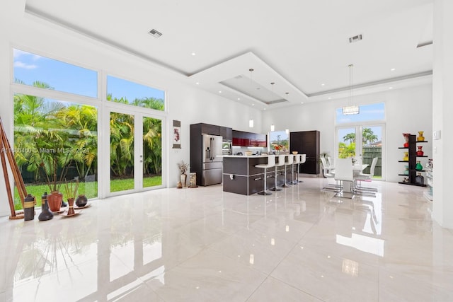 kitchen featuring a kitchen island, a healthy amount of sunlight, and a breakfast bar