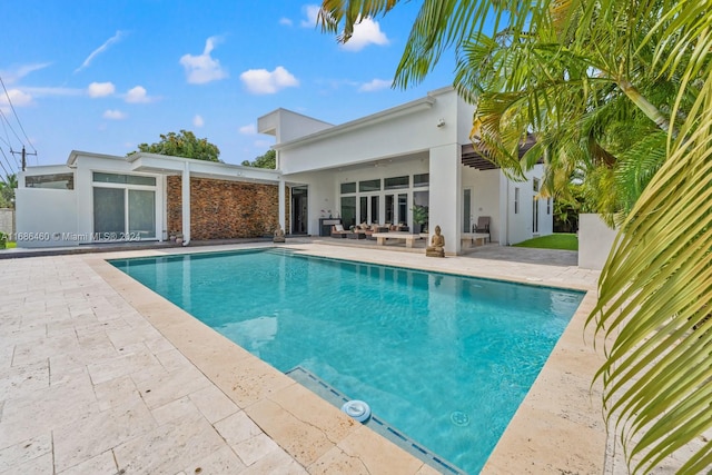 view of swimming pool with a patio area