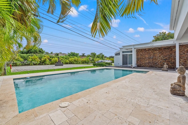 view of pool featuring a patio