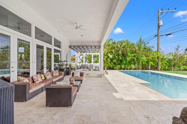 view of pool with ceiling fan, a patio, a pergola, and an outdoor living space