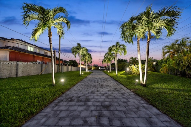 view of home's community featuring a lawn