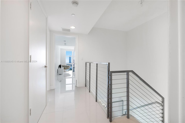 hallway with light tile patterned floors