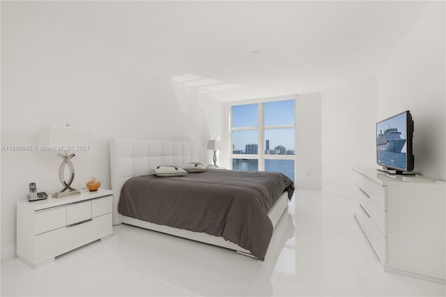 bedroom with light tile patterned floors