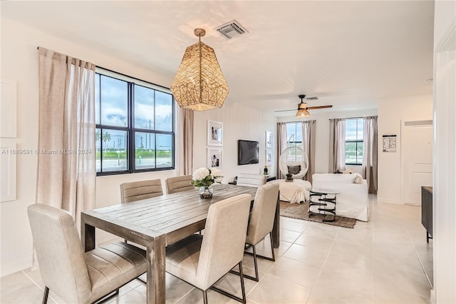 dining room with light tile patterned flooring and ceiling fan