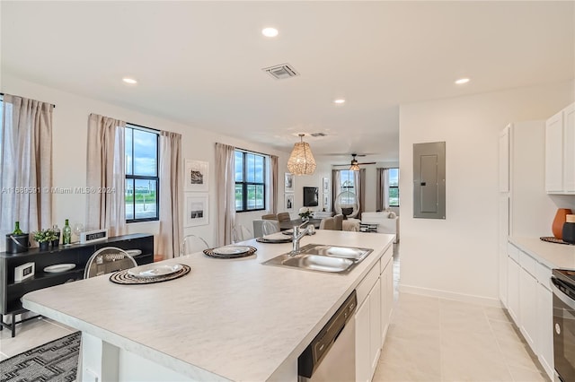 kitchen featuring white cabinetry, sink, a kitchen island with sink, electric panel, and dishwasher