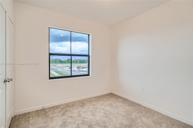 unfurnished room with carpet floors