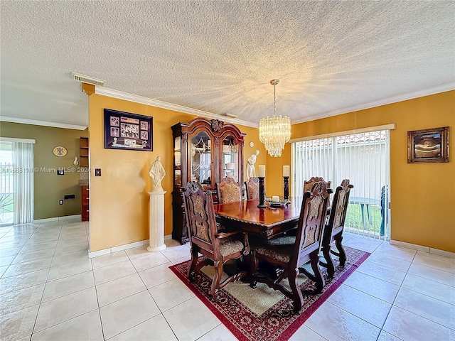 tiled dining space featuring a chandelier, a textured ceiling, and ornamental molding