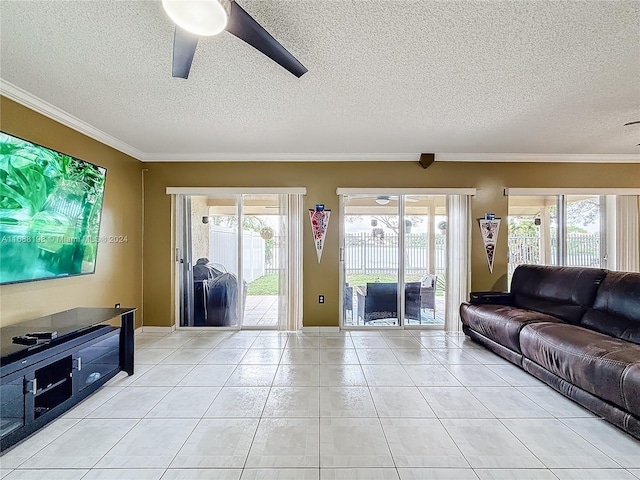 living room with a textured ceiling, crown molding, and plenty of natural light