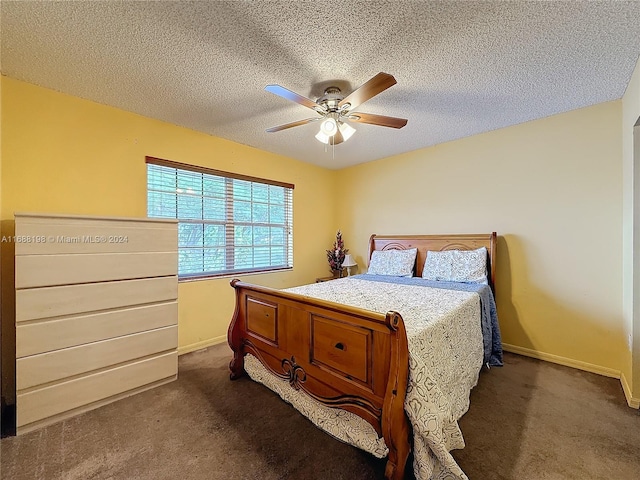 carpeted bedroom with a textured ceiling and ceiling fan