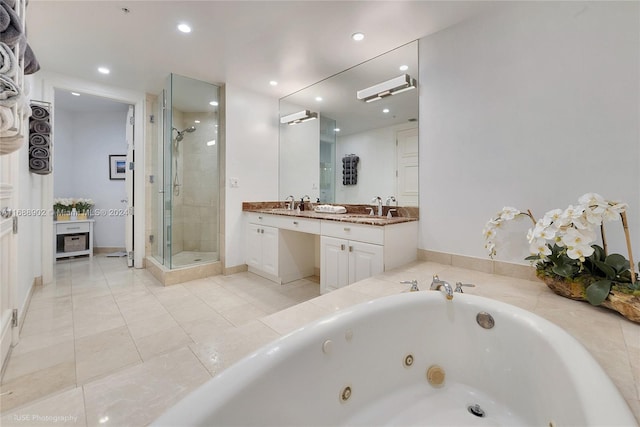 bathroom with plus walk in shower, vanity, and tile patterned floors