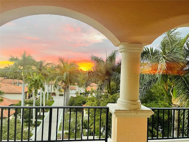 view of balcony at dusk