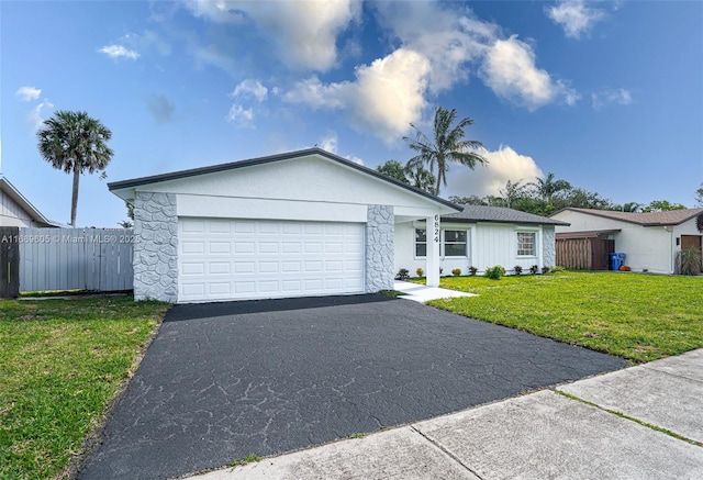 ranch-style house with a front yard and a garage