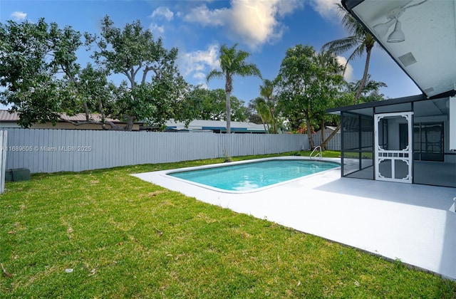 view of swimming pool with a lanai, a patio area, and a lawn