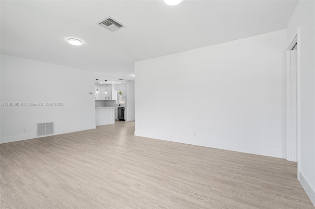 spare room featuring light wood-type flooring