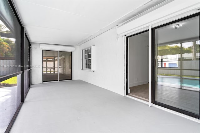 unfurnished sunroom featuring plenty of natural light