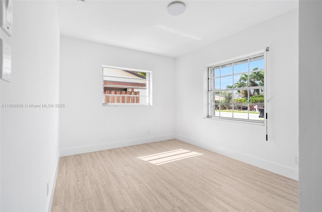 spare room with light wood-type flooring