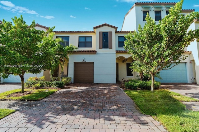 mediterranean / spanish-style home featuring a garage