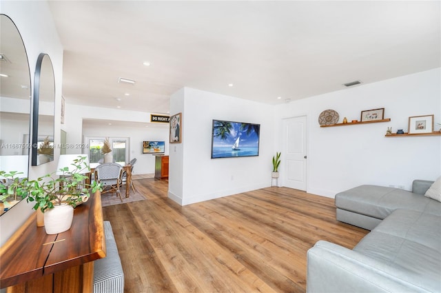 living room with light hardwood / wood-style floors