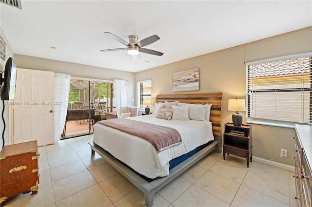 tiled bedroom featuring ceiling fan and access to exterior