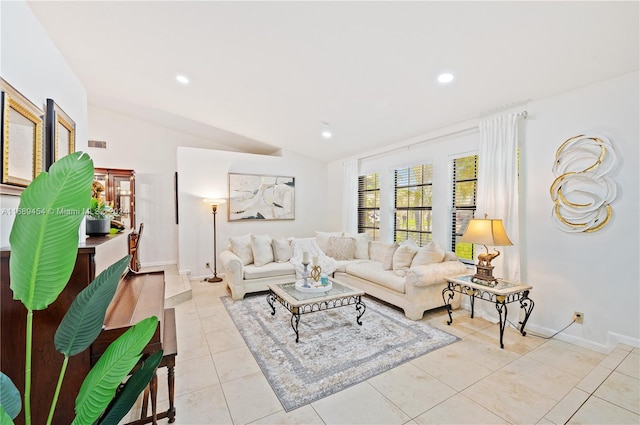 tiled living room featuring lofted ceiling