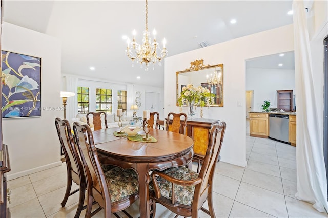 tiled dining room with a chandelier and lofted ceiling