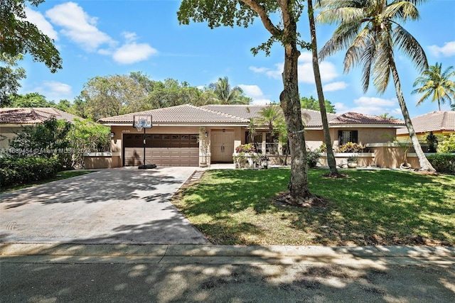 view of front of house with a garage and a front lawn